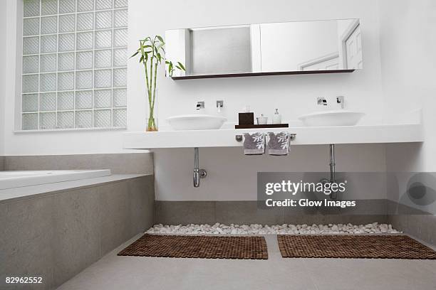 interiors of a bathroom - bath mat stockfoto's en -beelden