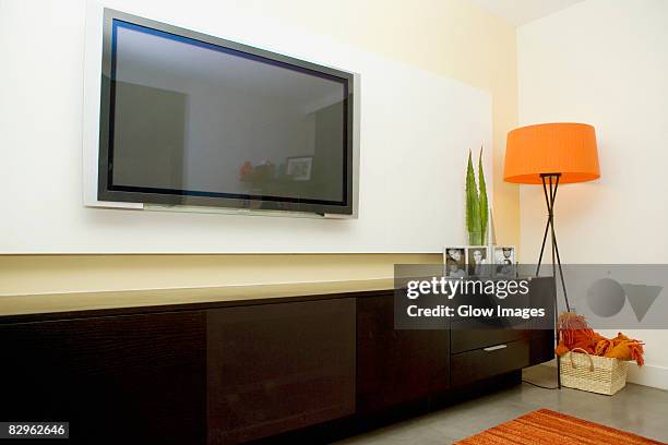 flat panel television in a living room - wide screen stock pictures, royalty-free photos & images