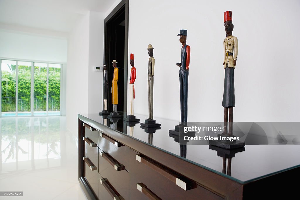 Figurines on a cabinet