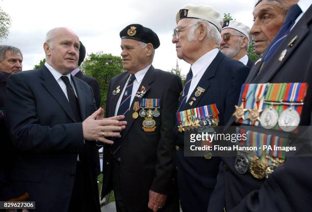 Dr John Reid, the newly appointed Defence Secretary speaks to Arctic convoy veterans Charles Chater, Keith Bell Frank Bond and William Thorpe, 82...