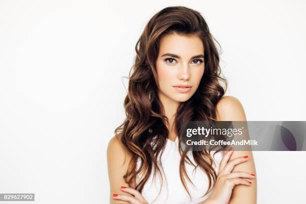 studio shot of young beautiful woman - dark hair stock pictures, royalty-free photos & images