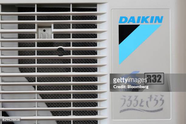 The outdoor unit of a Daikin Industries Ltd. R32 inverted split type air conditioner stands at the company's Shiga plant in Kusatsu, Shiga, Japan, on...