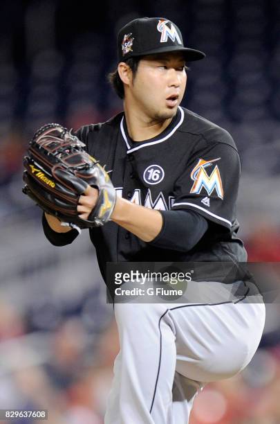 Junichi Tazawa of the Miami Marlins pitches in the eighth inning against the Washington Nationals at Nationals Park on August 10, 2017 in Washington,...
