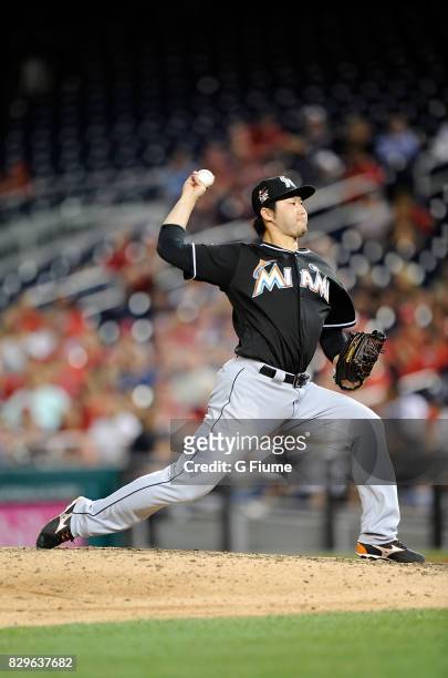 Junichi Tazawa of the Miami Marlins pitches in the eighth inning against the Washington Nationals at Nationals Park on August 10, 2017 in Washington,...