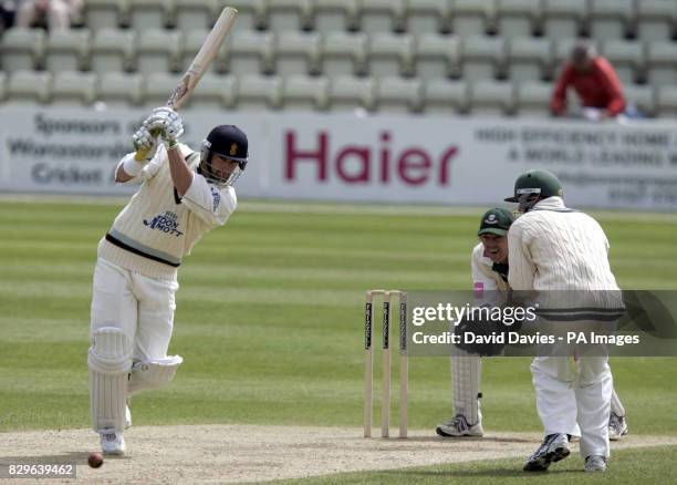 Derbyshire's Michael Di Venuto drives a delivery from Worcestershire's Gareth Batty as Derbyshire follow.