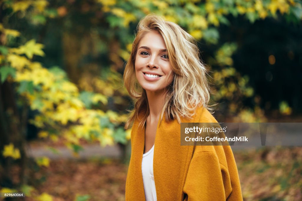 Autumn photo of a beautiful girl