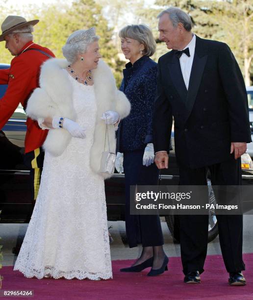 Canadian Prime Minister, Paul Martin, and his wife Sheila greet Queen Elizabeth II as she arrives for a dinner hosted by the Canadian Government.