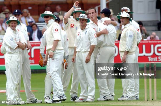 England's Simon Jones celebrates with team-mates after taking the wicket of Bangladesh batsman Javed Omar.