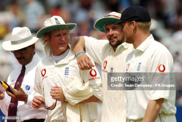England's Matthew Hoggard, Stephen Harmison and Andrew Flintoff celebrate after Bangladesh's innings is over.