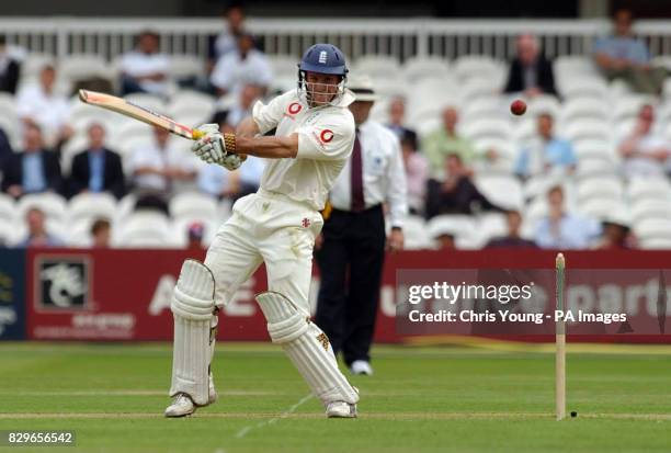 Andrew Strauss sends a delivery towards the boundary.