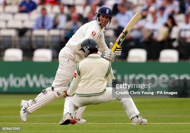 England batsman Marcus Trescothick hits the ball past Bangladesh's Mohammad Ashraful.
