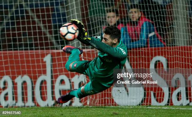 Nicolas Gaston Navarro of San Lorenzo saves the last penalty kick during the penalty shootout after a second leg match between San Lorenzo and Emelec...