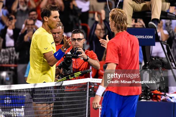 Rafael Nadal of Spain congratulates Denis Shapovalov of Canada for his victory during day seven of the Rogers Cup presented by National Bank at...