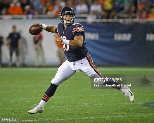 Mitchell Trubisky of the Chicago Bears looks for a receiver against the Denver Broncos during a preseason game at Soldier Field on August 10, 2017 in...