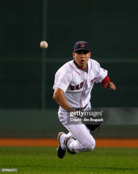 Jacoby Ellsbury of the Boston Red Sox dives but is unable to catch a line drive in the fifth inning against the Cleveland Indians at Fenway Park on...