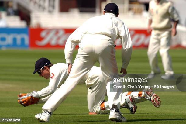 England's Geraint Jones dives in front of Andrew Flintoff to catch Bangladesh's Mohammed Rafique out.