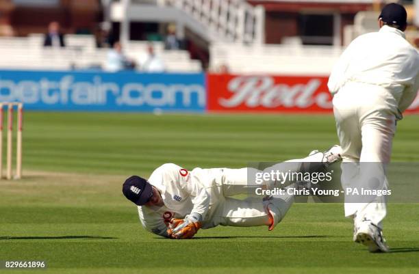 England's Geraint Jones dives in front of Andrew Flintoff to catch Bangladesh's Mohammed Rafique.