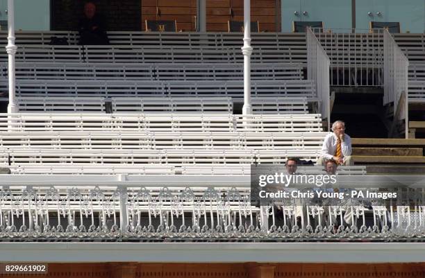 Sparsely populated pavilion watches England play Bangladesh.