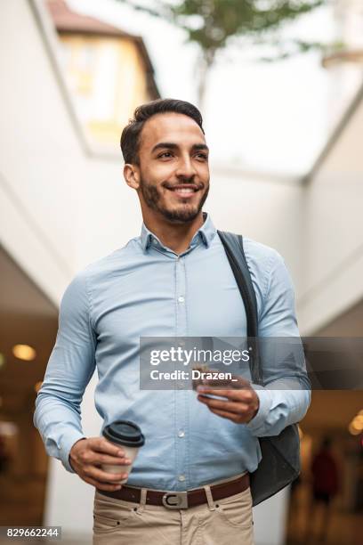 businessman going to work and eating protein bar - muesli bar stock pictures, royalty-free photos & images