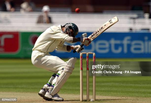 Bangladesh's Anwar Hossain ducks a bouncer from England's Andrew Flintoff.