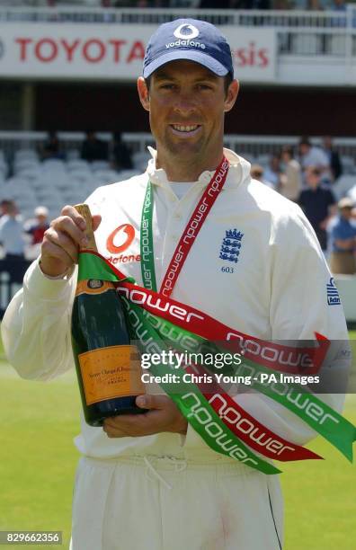 England's Marcus Trescothick displays his man of the match award.