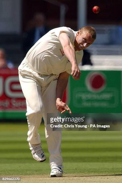 England's Andrew Flintoff sends down a delivery.