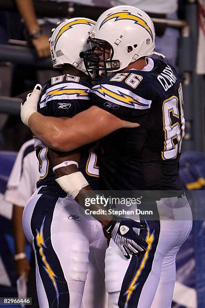 Tight end Antonio Gates and Jeromey Clary of the San Diego Chargers celebrate Gates six-yard touchdown catch against the New York Jets on September...