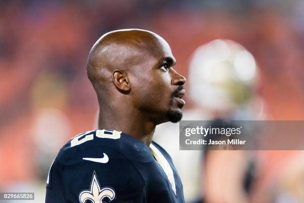 Running back Adrian Peterson of the New Orleans Saints watches from the sidelines during the second half of a preseason game against the Cleveland...