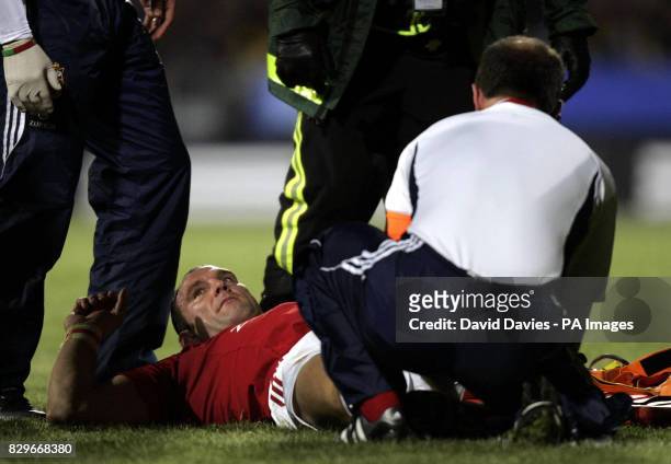 British and Irish Lion Lawrence Dallaglio receives treatment from Dr James Robson during their 34-20 victory.