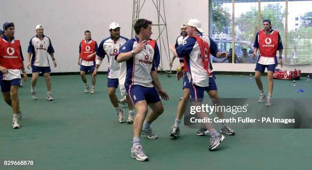 The England cricket squad warm up for a training session at the Bangladesh Institute of Sport in Dhaka, as they prepare to take on Bangladesh in the...