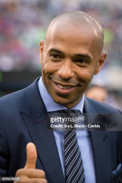 Thierry Henry legend of Juventus gives a thumbs at the start of the International Champions Cup match between FC Barcelona and Juventus at the...