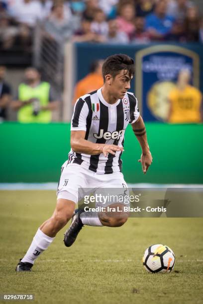 Paulo Dybala of Juventus takes the ball across the pitch during the International Champions Cup match between FC Barcelona and Juventus at the...