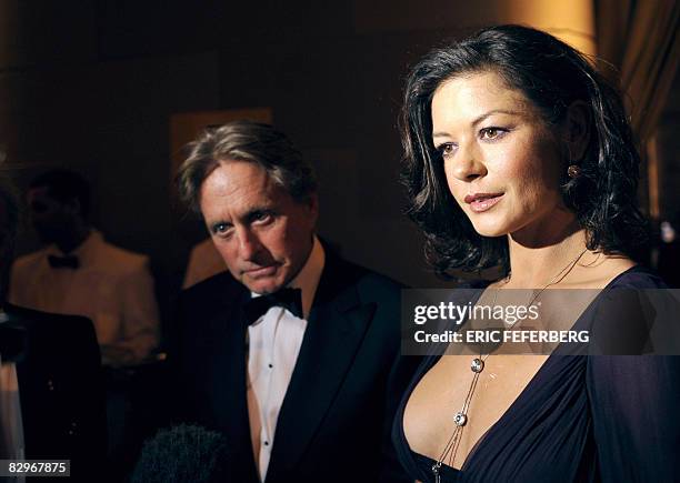 Actor Michael Douglas and his wife Catherine Zeta-Jones attend a ceremony where French President Nicolas Sarkozy received the Humanitarian Award on...