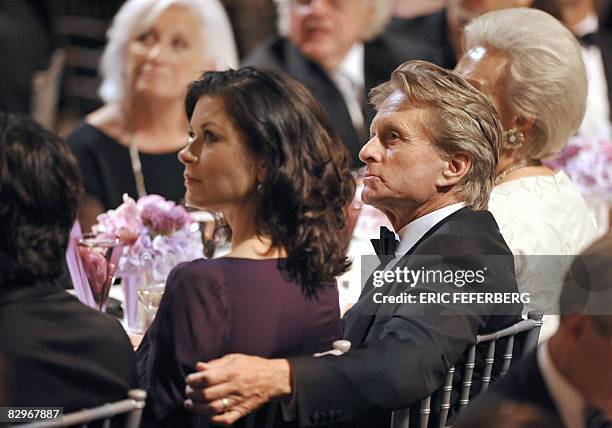 Actor Michael Douglas and his wife Catherin Zeta-Jones attend a ceremony during which French President Nicolas Sarkozy received the Humanitarian...