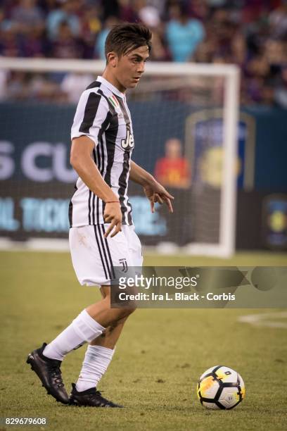 Paulo Dybala of Juventus looks for the open man during the International Champions Cup match between FC Barcelona and Juventus at the MetLife Stadium...