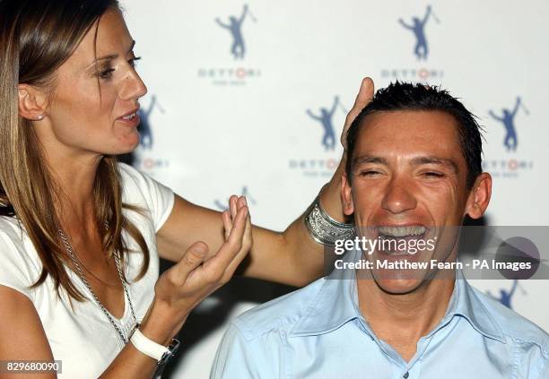 Jockey Frankie Dettori has hair gel applied by his wife Catherine during the launch of the Dettori male grooming range.