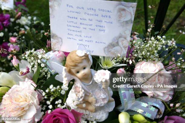 Floral tributes and a message for Emma and Phoebe Hicks left at the funeral service by Nanny, Aldrene Catley, the mother of Joanne Catley. Hundreds...