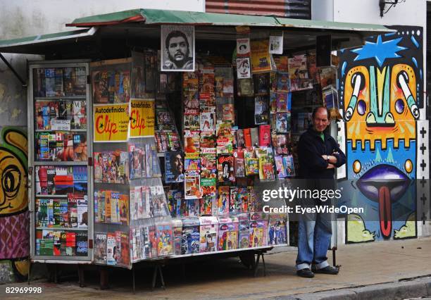Newsdealer stands infront of his kiosk on January 13, 2008 in Buenos Aires, Argentina. The Republic of Argentina is a former spanish colony and the...