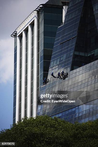 Window cleaners polish windows of a skyscraper in the commercial and financial district on January 13, 2008 in Buenos Aires , Argentina. The Republic...