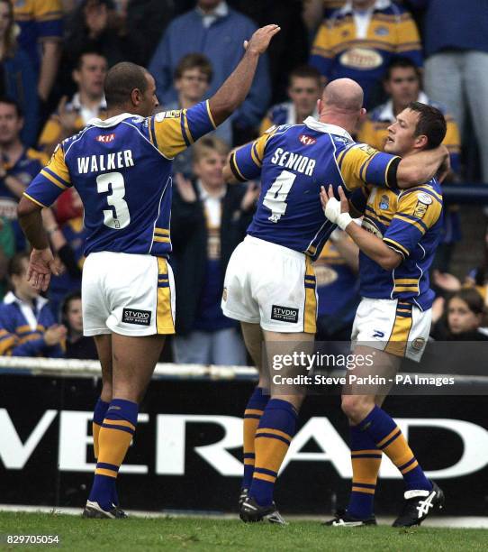 Leeds Rhinos' Danny McGuire celebratres with team-mates keith Senior and Chev Walker.