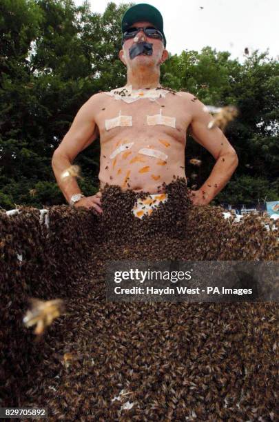 Philip McCabe, before attempting to break the world record for a 'beard of bees' in a field near Cahir, Co Tipperary. The record is gauged by...