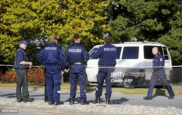 Police guard a school in Kauhajoki, southwestern Finland, on September 23, 2008 where nine people were killed when a gunman went on a shooting...