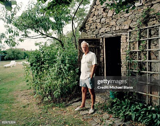 portrait of mature man standing in garden - french garden stock-fotos und bilder