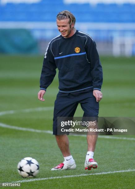 David Beckham takes part in training in the Bernabeu Stadium, Madrid, before Manchester United's Champions League match against Real Madrid. THIS...