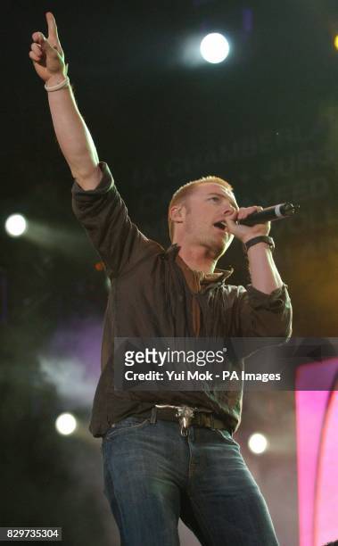 Ronan Keating performs on stage.