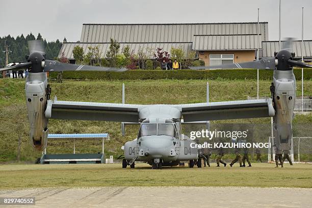 This photograph taken on April 18, 2016 shows a US Marine tilt-rotor Osprey aircraft at an emergency helicopter landing site in Minami-Aso, Kumamoto...