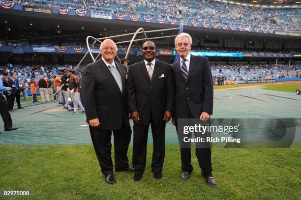 Announcers Jon Miller, Joe Morgan and Peter Gammons on the field prior to the final game ever at Yankee Stadium between the Baltimore Orioles and the...