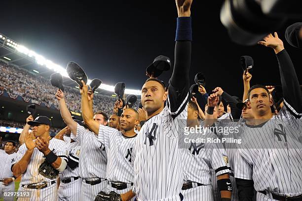 Derek Jeter, captain of the New York Yankees tips his cap to the fans after the final game ever at Yankee Stadium between the Baltimore Orioles and...