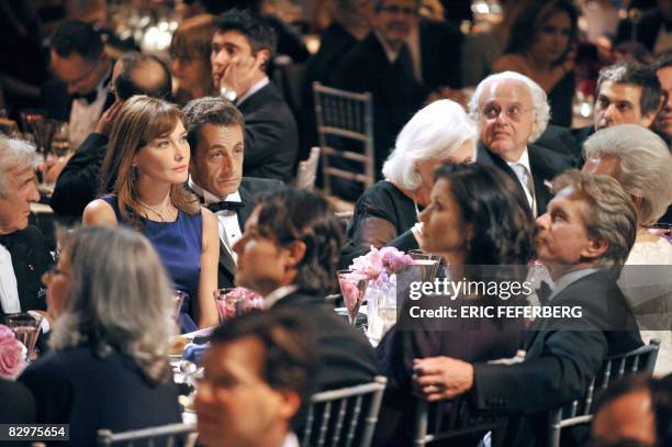 French President Nicolas Sarkozy and his wife Carla Bruni-Sarkozy attend a ceremony with US actor Michael Douglas and his wife Catherine Zeta-Jones...