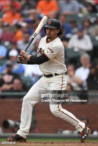 Jarrett Parker of the San Francisco Giants hits an rbi single scoring Denard Span against the Chicago Cubs in the bottom of the seventh inning at...